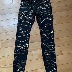 Nike black and shiny gold leggings